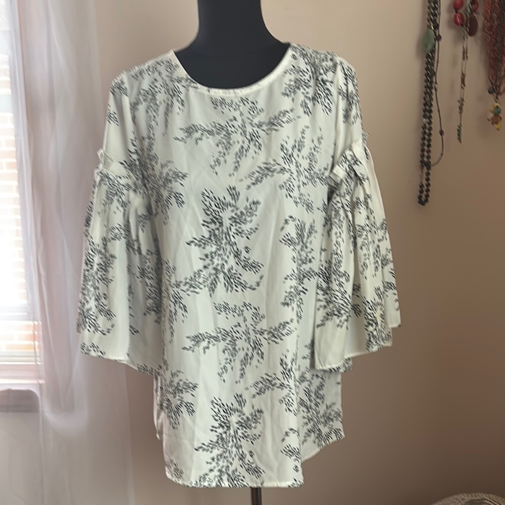 White Blouse with Flutter Sleeves and Ruffled Style